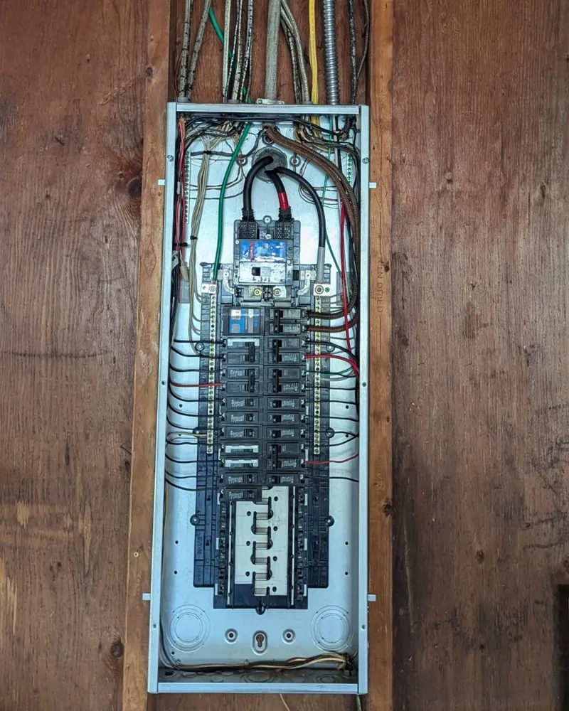 Newly installed electrical panel with labeled breakers